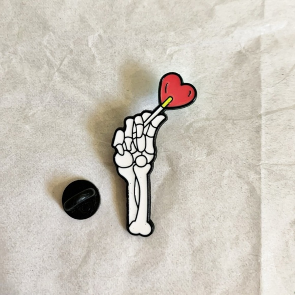 3/$15 Brand New Skeleton Hand Holding Cartoon Candy Heart Enamel Pin 1.75”